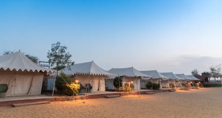 Luxury desert camp tents in Jaisalmer at sunset