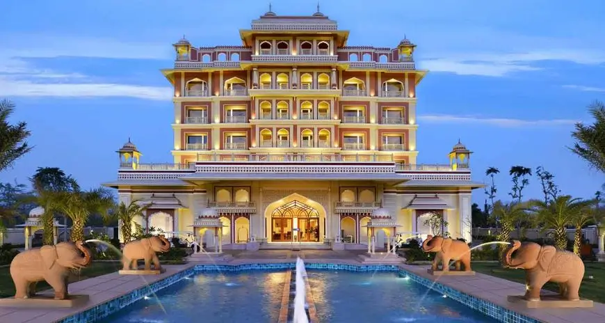 Luxury palace hotel with pool and elephant statues